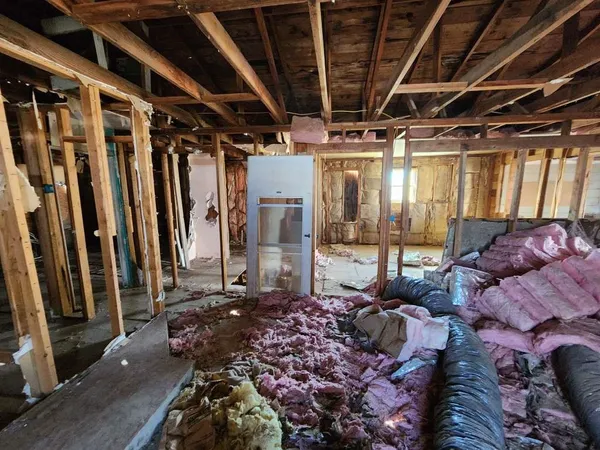 a living room with lots of furniture and a rug