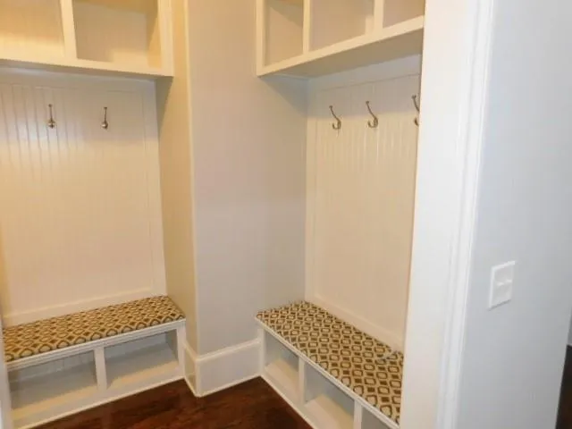 a view of room with wooden floor