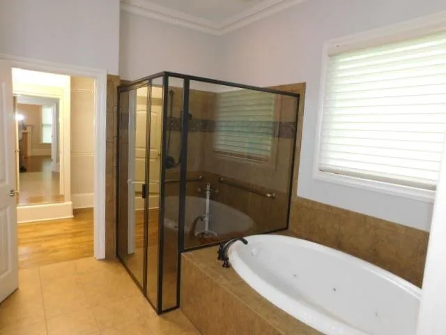 a bathroom with a bathtub and a shower