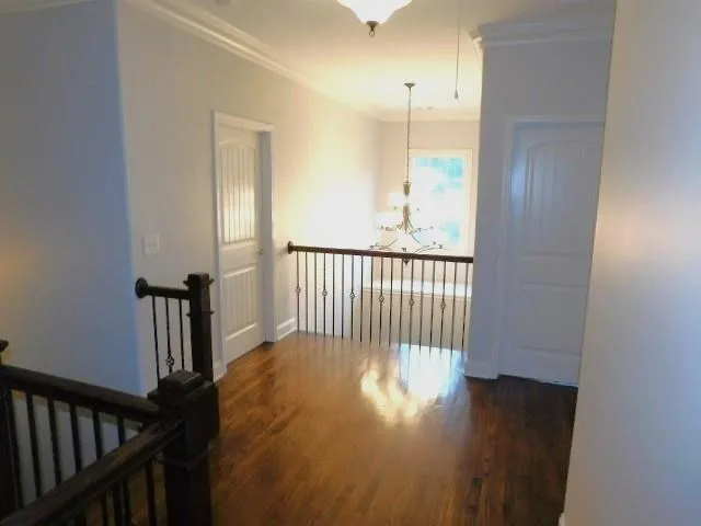 a view of hallway with wooden floor