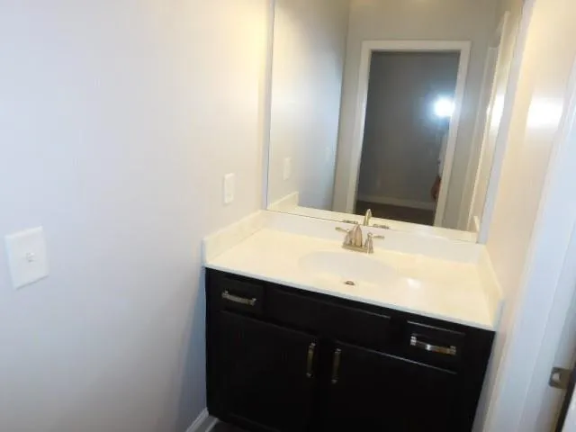 a bathroom with a white toilet and a shower