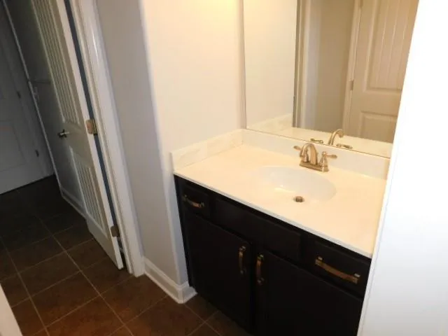 a white toilet sitting next to a window