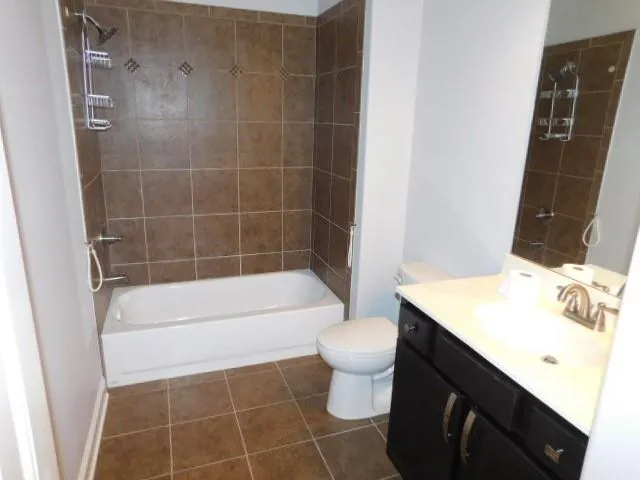 a view of front of house with a yard