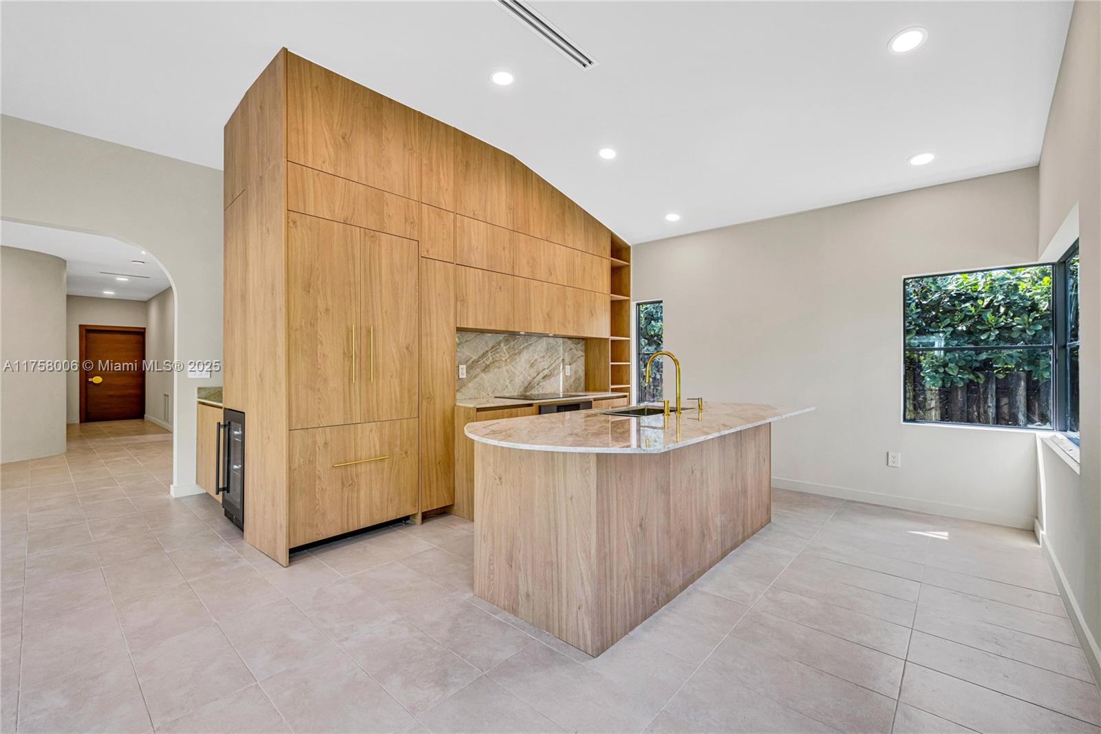 1323 Cleveland Road Miami Beach, FL 33141 - Photo 12 of 43 a view of a kitchen with furniture and a window