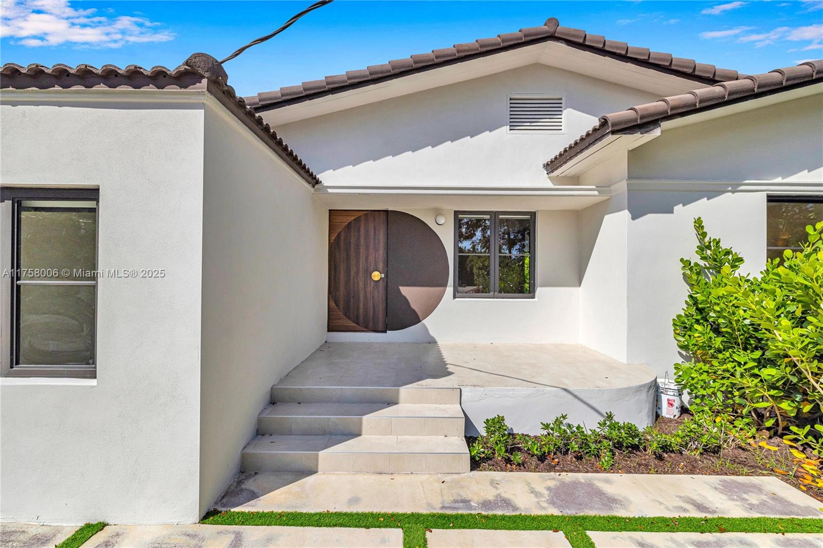 1323 Cleveland Road Miami Beach, FL 33141 - Photo 2 of 43 a front view of a house with a yard