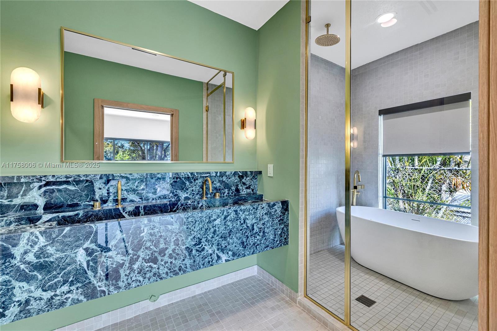 1323 Cleveland Road Miami Beach, FL 33141 - Photo 24 of 43 a bathroom with a bathtub and a mirror