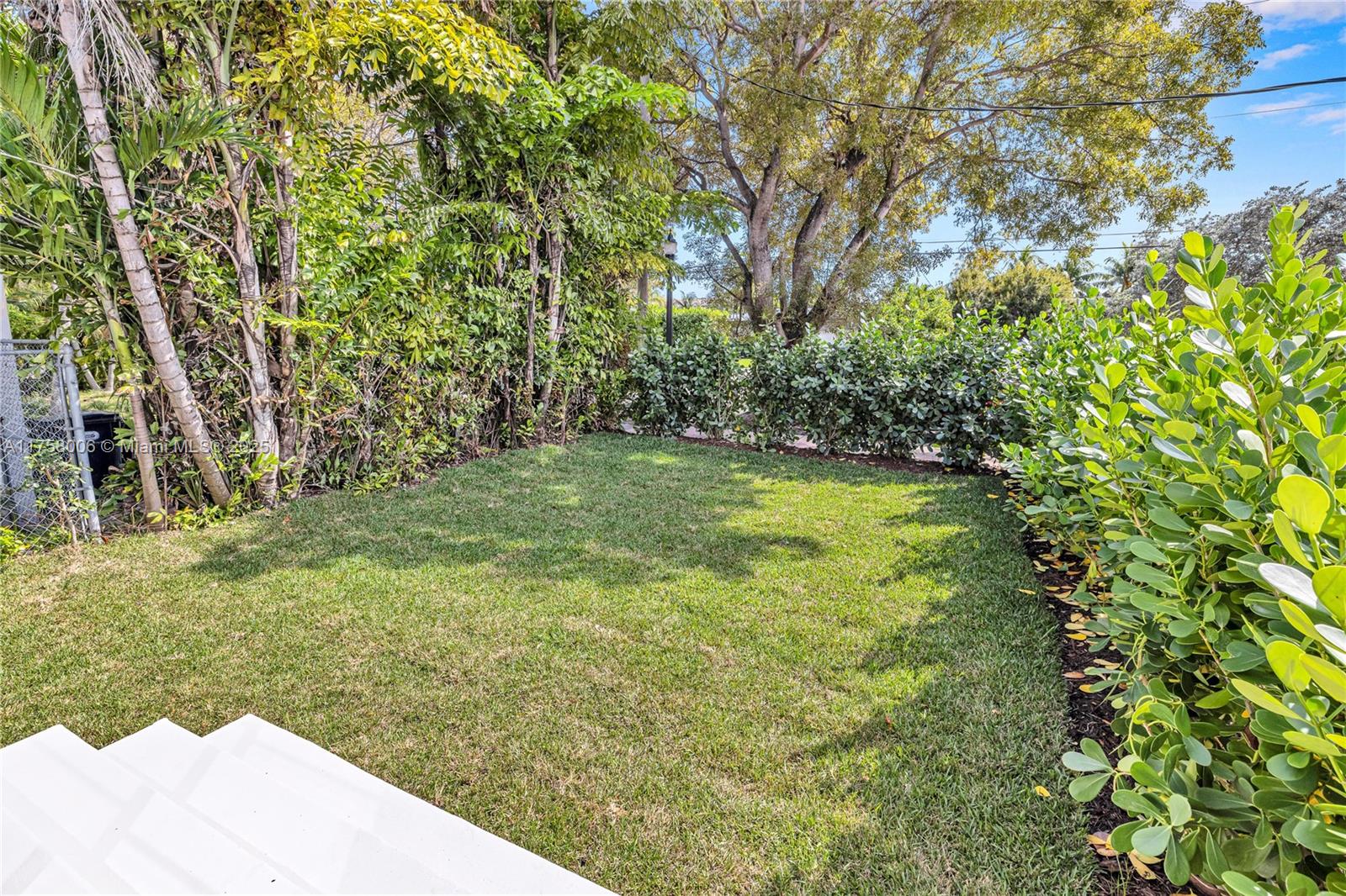 1323 Cleveland Road Miami Beach, FL 33141 - Photo 27 of 43 a view of yard with swimming pool and trees