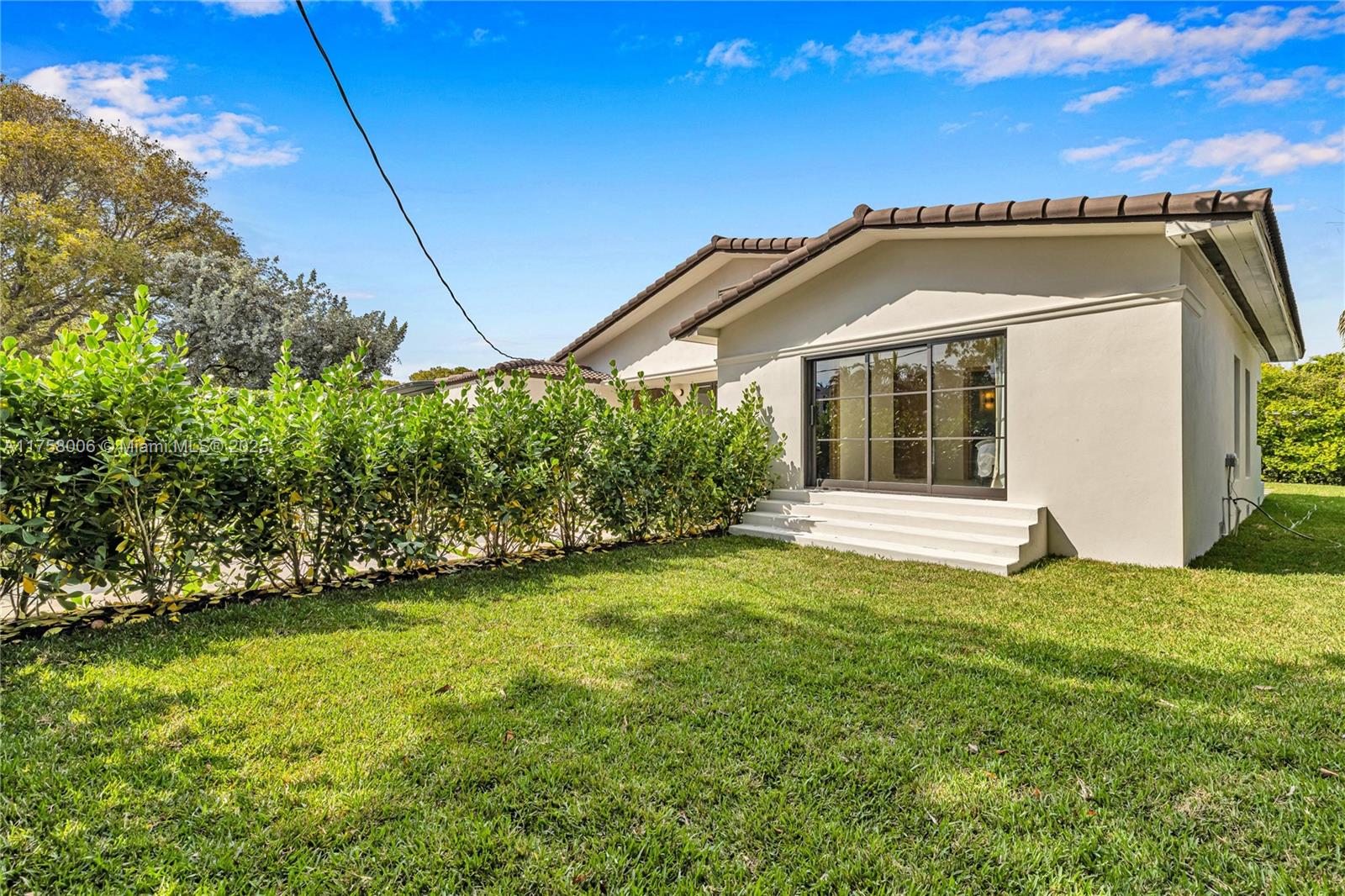 1323 Cleveland Road Miami Beach, FL 33141 - Photo 28 of 43 a view of a house with a big yard