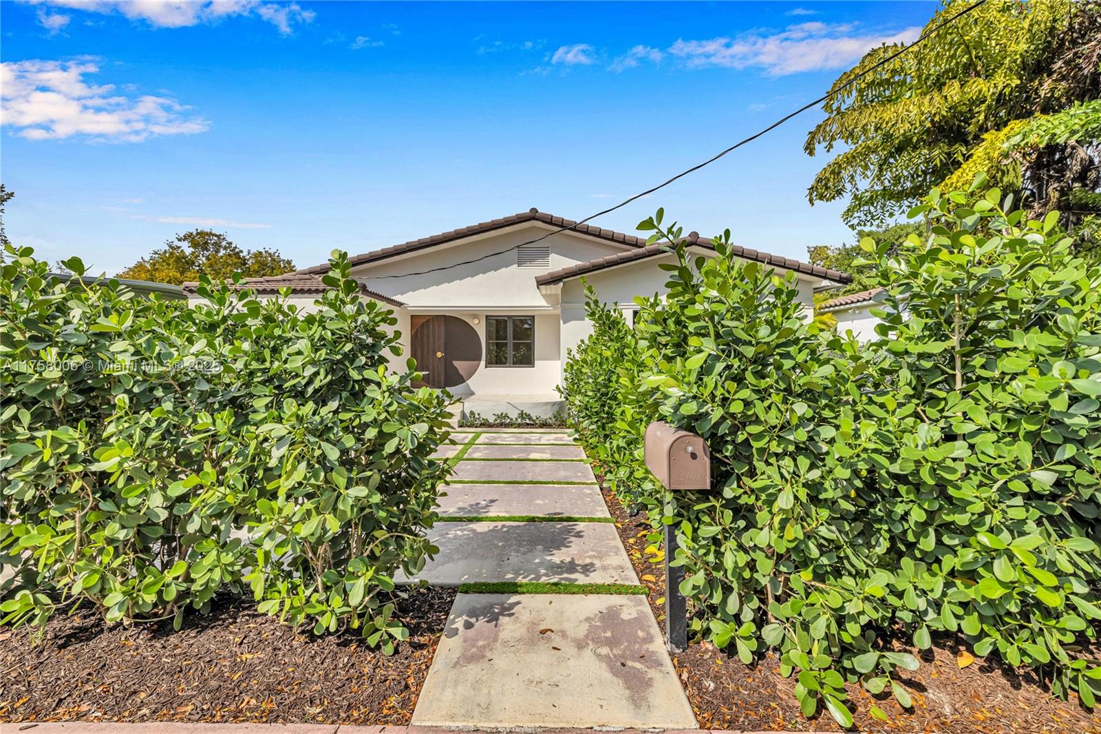 1323 Cleveland Road Miami Beach, FL 33141 - Photo 3 of 43 a front view of a house with a yard