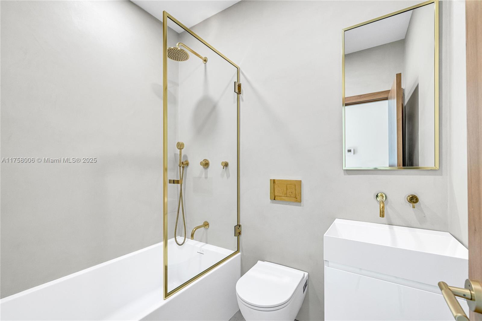 1323 Cleveland Road Miami Beach, FL 33141 - Photo 33 of 43 a bathroom with a sink toilet and shower