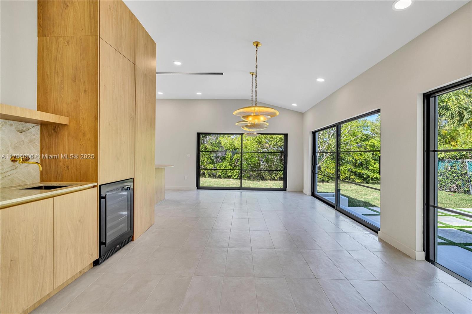 1323 Cleveland Road Miami Beach, FL 33141 - Photo 7 of 43 a large kitchen with a window and outdoor space