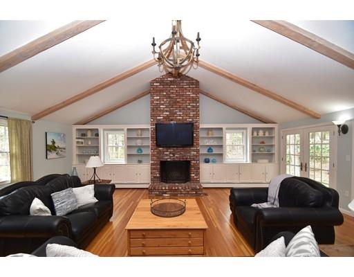 180 Rowley Bridge Road Topsfield, MA 01983 - Photo 12 of 30 a living room with furniture and a fireplace