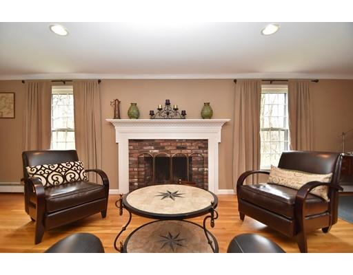 180 Rowley Bridge Road Topsfield, MA 01983 - Photo 7 of 30 a living room with furniture and a fireplace