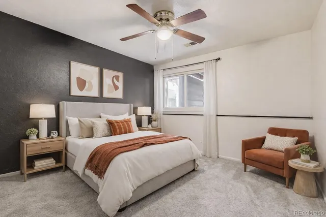 a bedroom with a bed and a couch