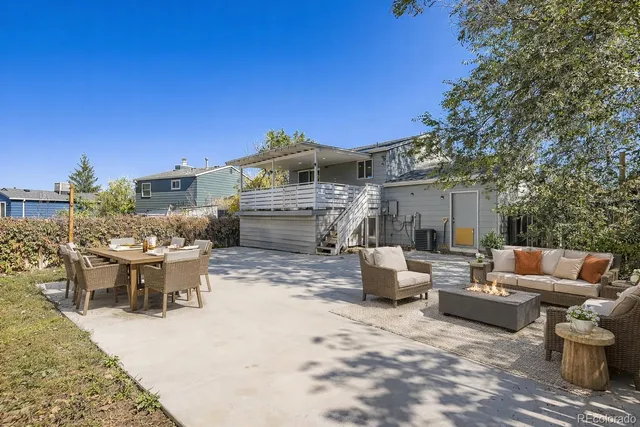 a view of a patio with couches and potted plants