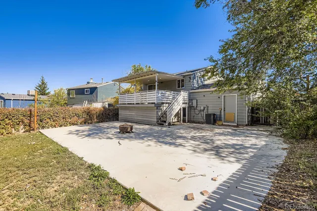 a view of a house with snow on the road