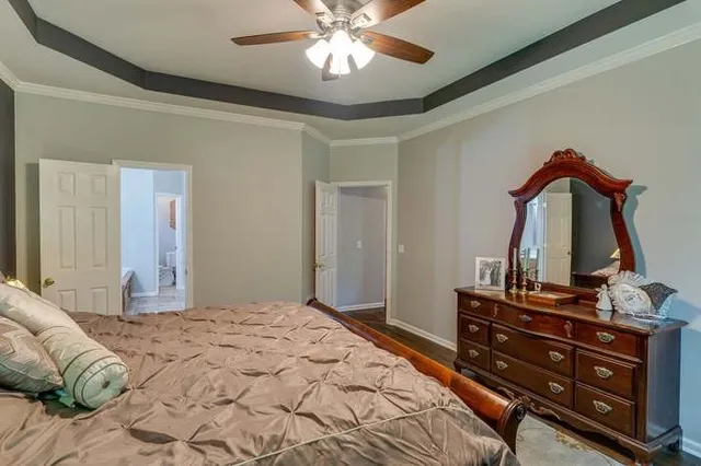 a bedroom with a bed and a dresser