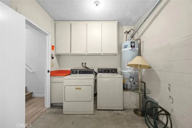 a view of storage and utility room with washer and dryer