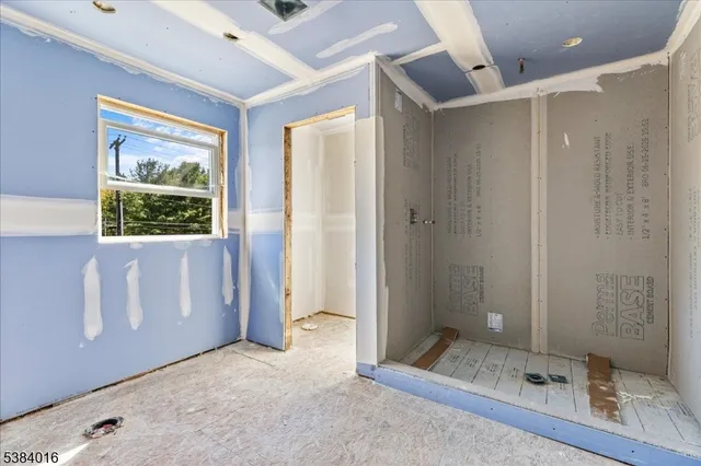 a view of an empty room with a window