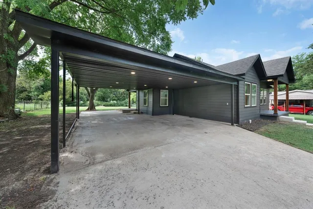 a house that has a tree in front of it