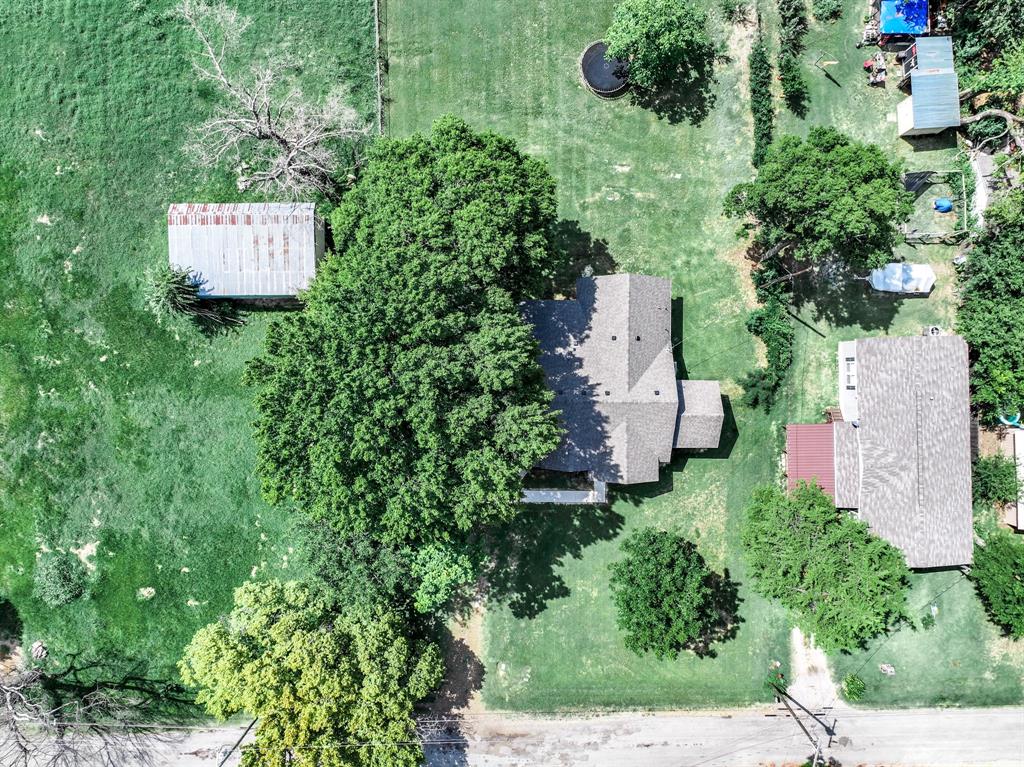 104 Mockingbird Street Ector, TX 75439 - Photo 35 of 40 an aerial view of a house with lots of trees
