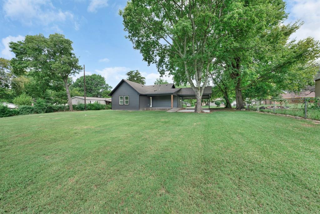 104 Mockingbird Street Ector, TX 75439 - Photo 39 of 40 a view of a house with a yard