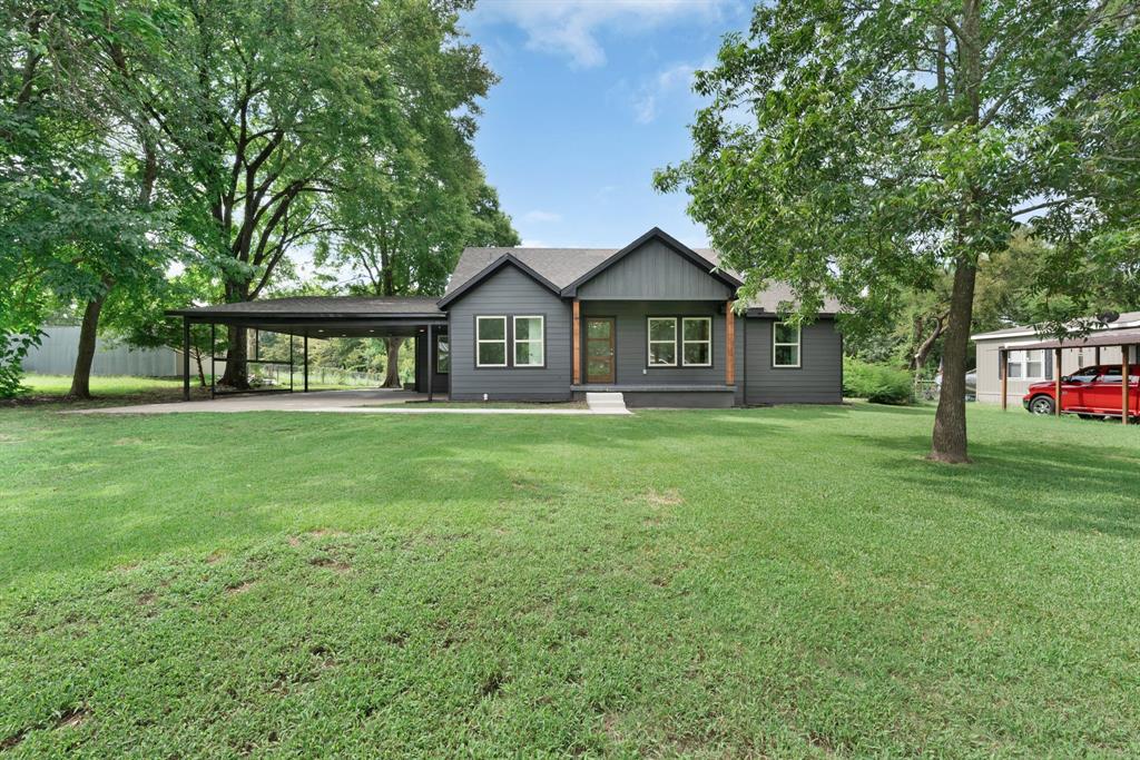 104 Mockingbird Street Ector, TX 75439 - Photo 4 of 40 a front view of a house with garden