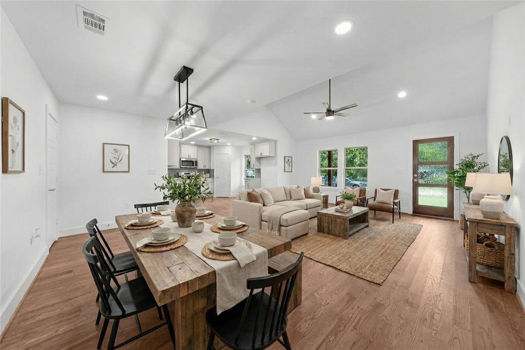 104 Mockingbird Street Ector, TX 75439 - Photo 5 of 40 a view of a dining room with furniture window and wooden floor