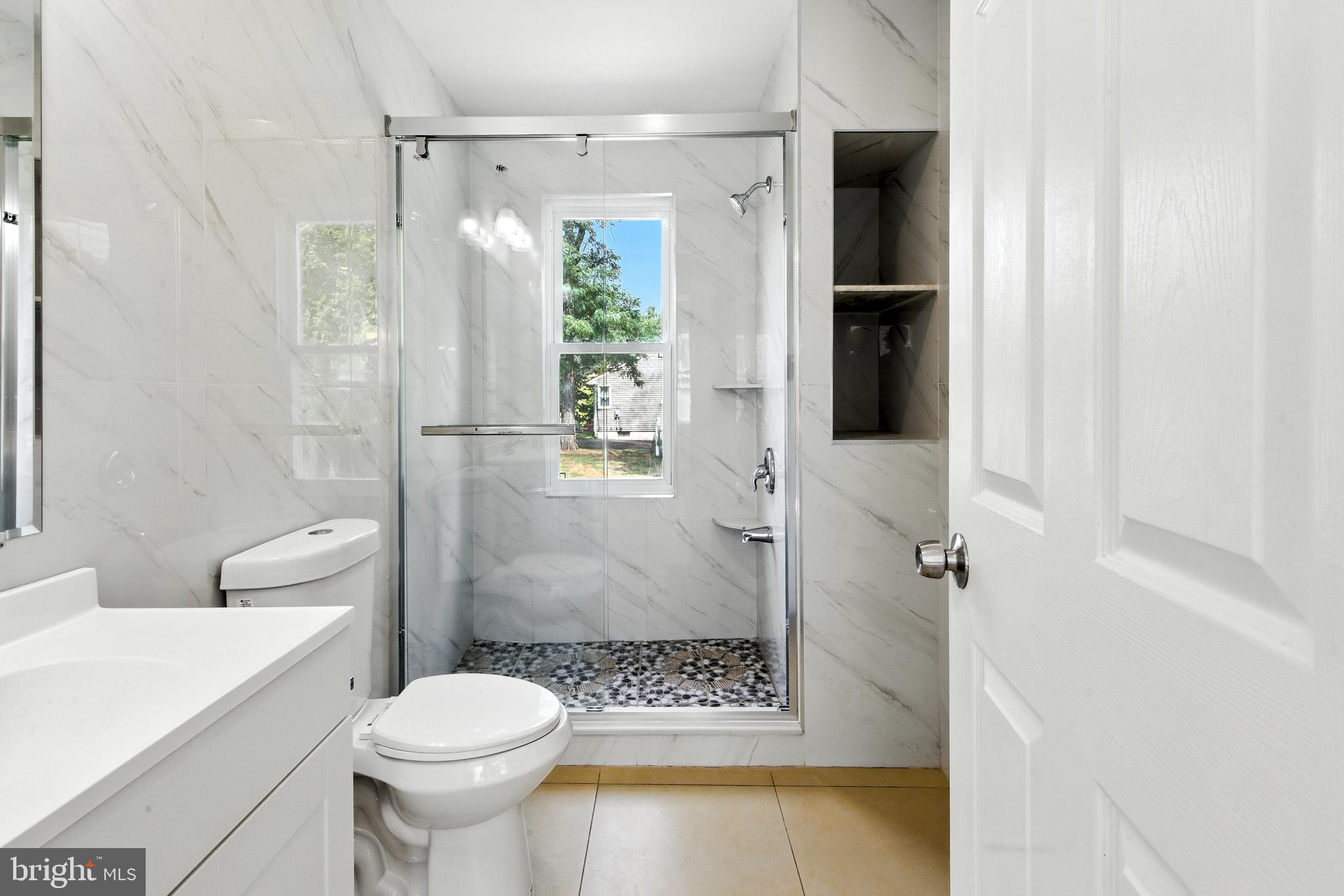 403 South Lenola Road Moorestown, NJ 08057 - Photo 12 of 26 a bathroom with a toilet and a shower
