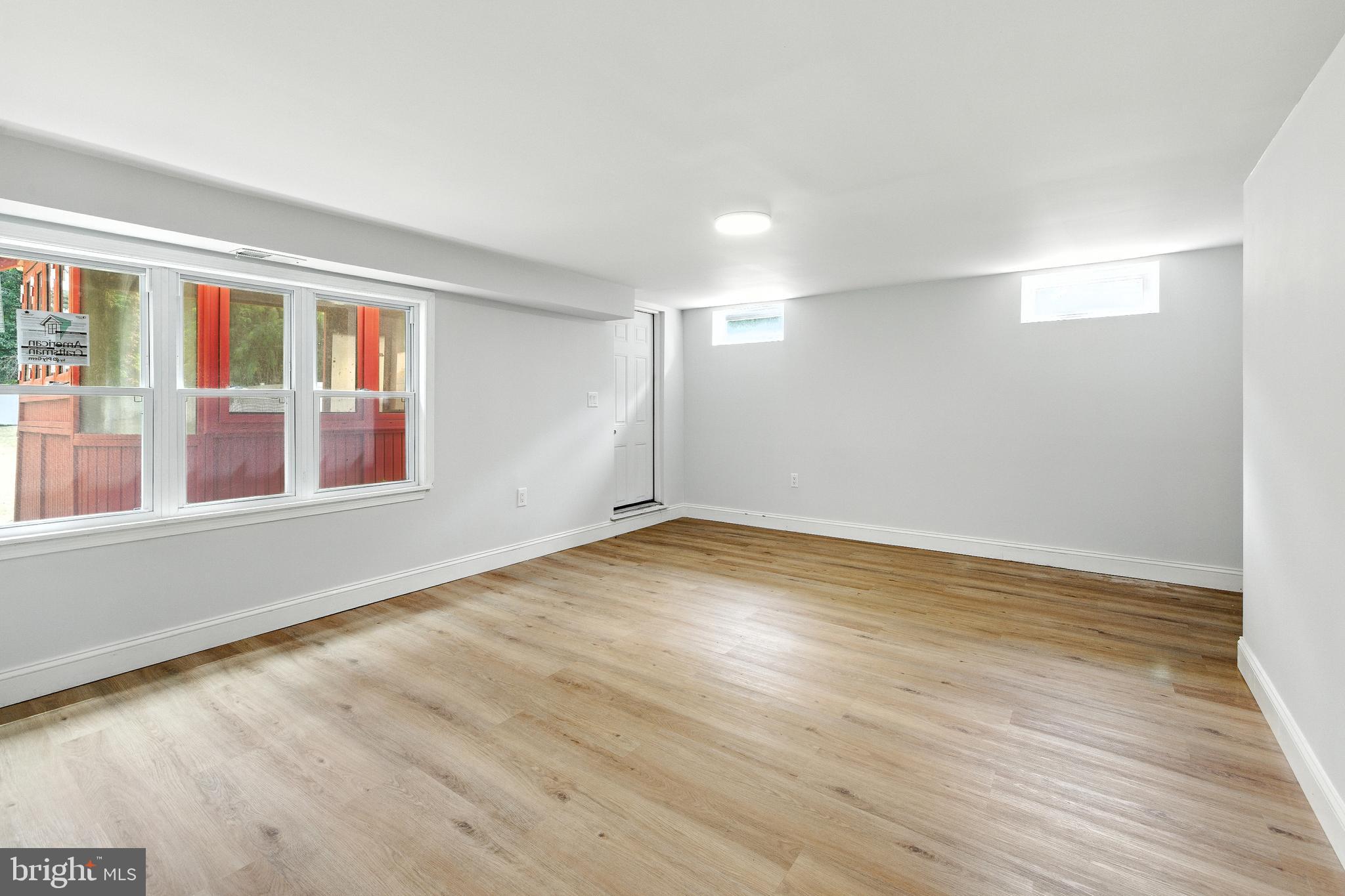 403 South Lenola Road Moorestown, NJ 08057 - Photo 17 of 26 a view of empty room with wooden floor and fan