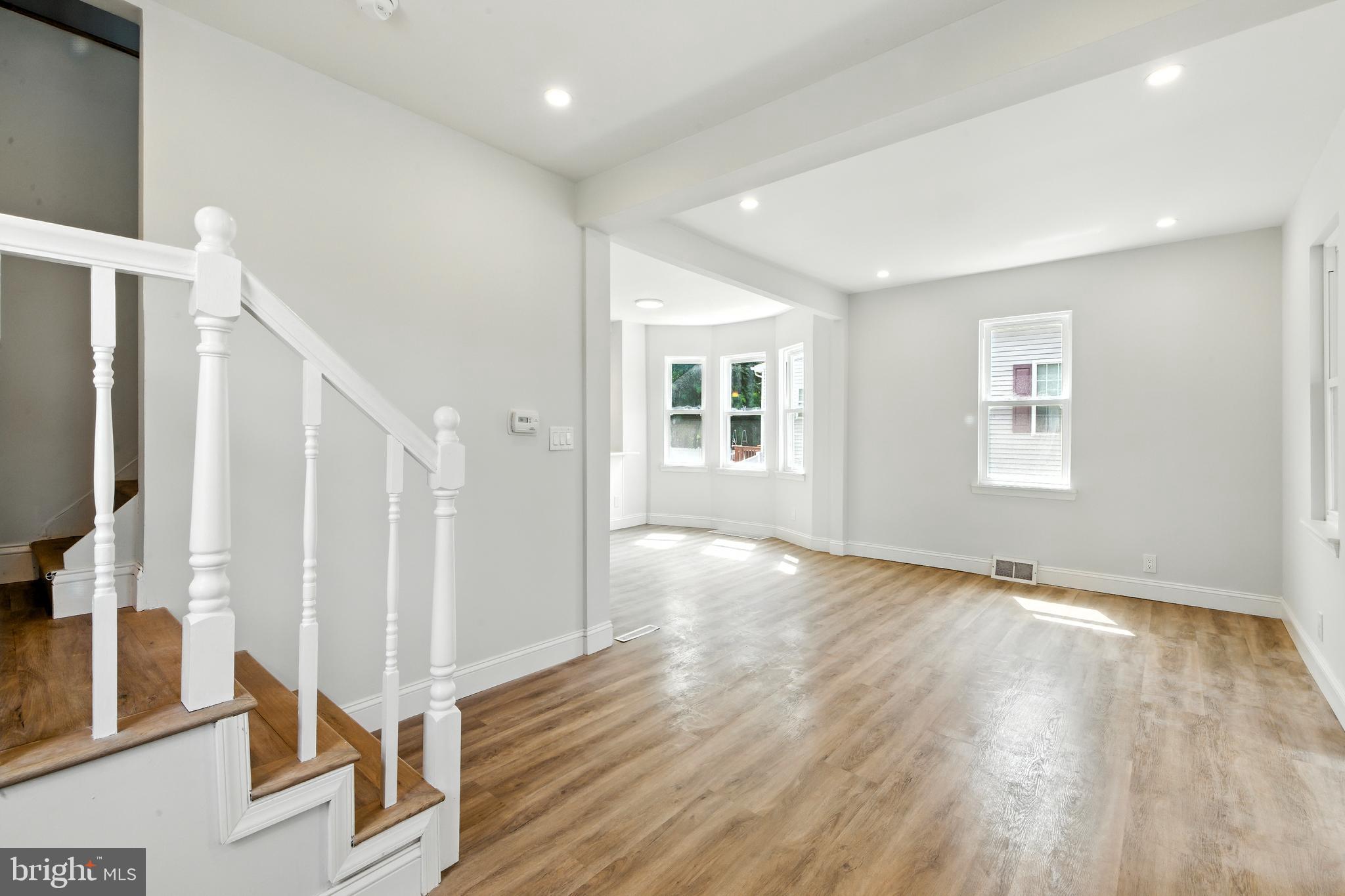 403 South Lenola Road Moorestown, NJ 08057 - Photo 4 of 26 a view of an empty room with wooden floor and a window
