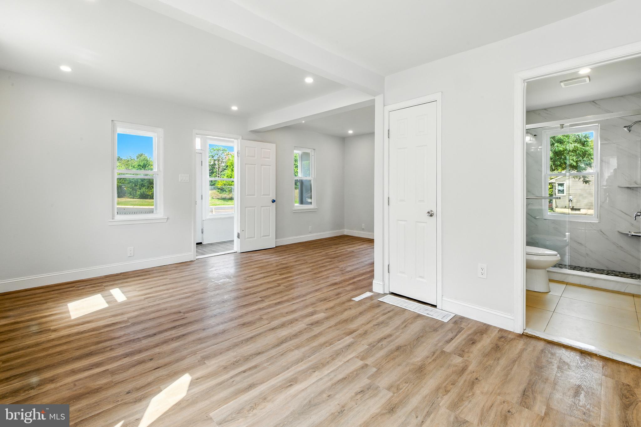 403 South Lenola Road Moorestown, NJ 08057 - Photo 6 of 26 an empty room with wooden floor and windows