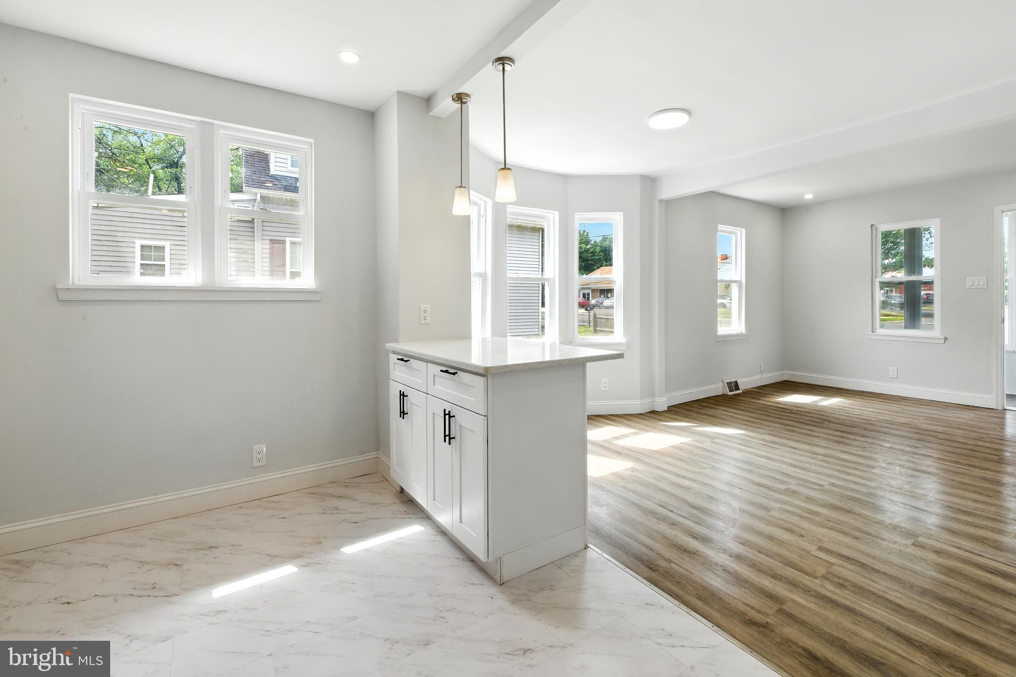 403 South Lenola Road Moorestown, NJ 08057 - Photo 7 of 26 a view of an empty room with wooden floor and a window