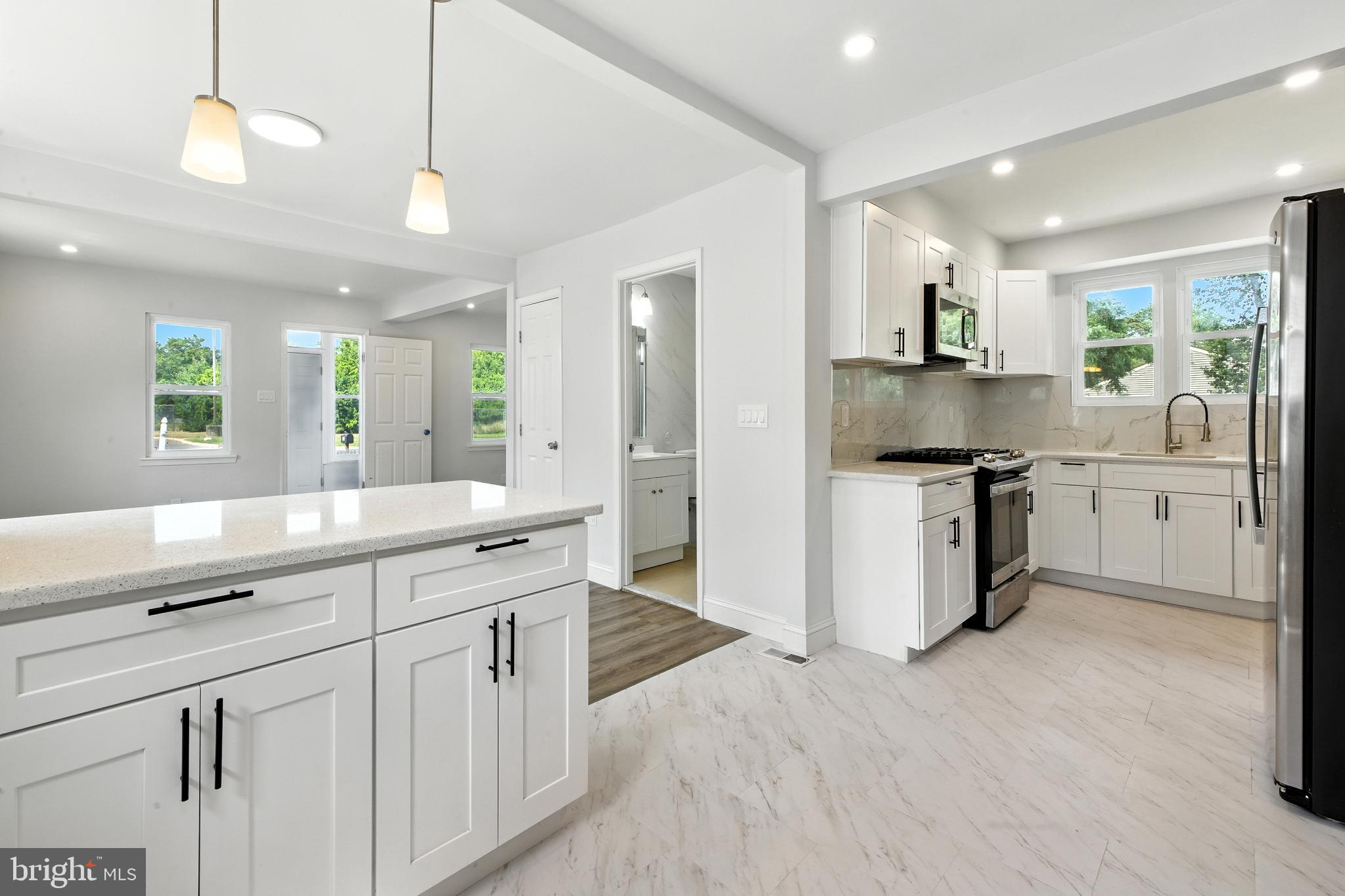 403 South Lenola Road Moorestown, NJ 08057 - Photo 8 of 26 a large kitchen with cabinets and stainless steel appliances