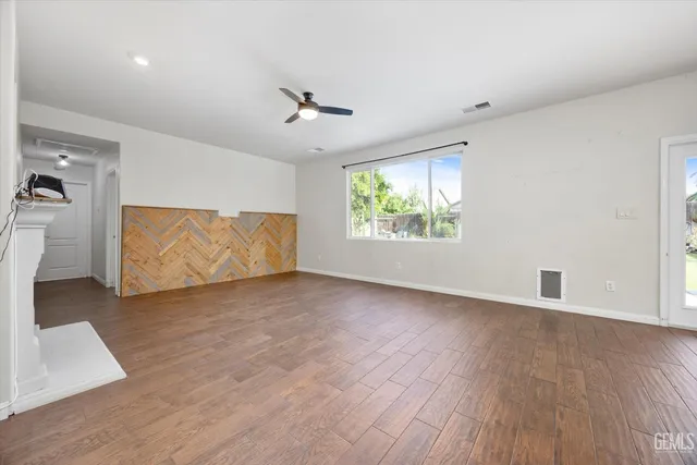 a view of a living room a window and a fireplace