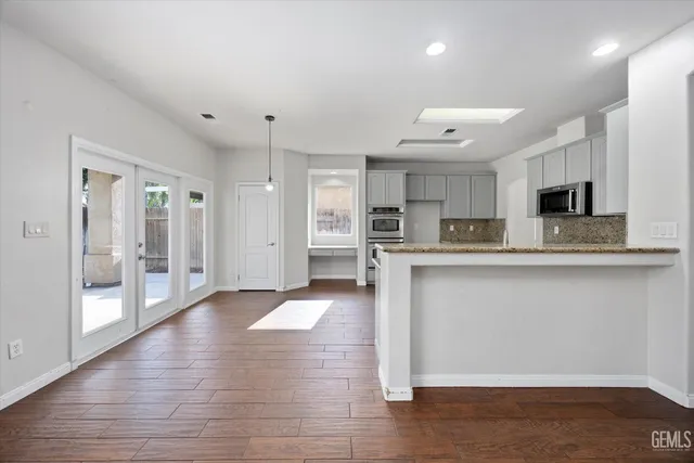 a view of livingroom with furniture wooden floor and window