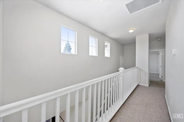 a view of a livingroom with a ceiling fan and window