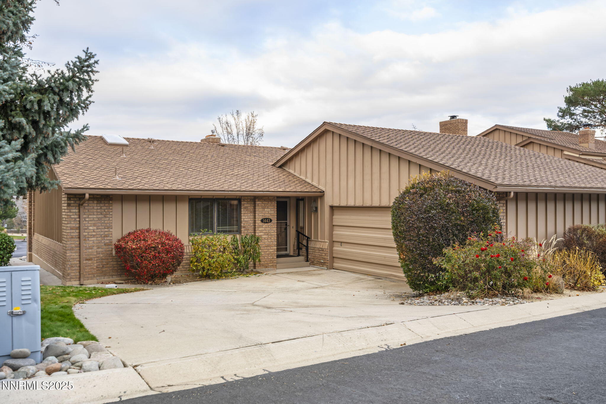 a front view of a house with garage