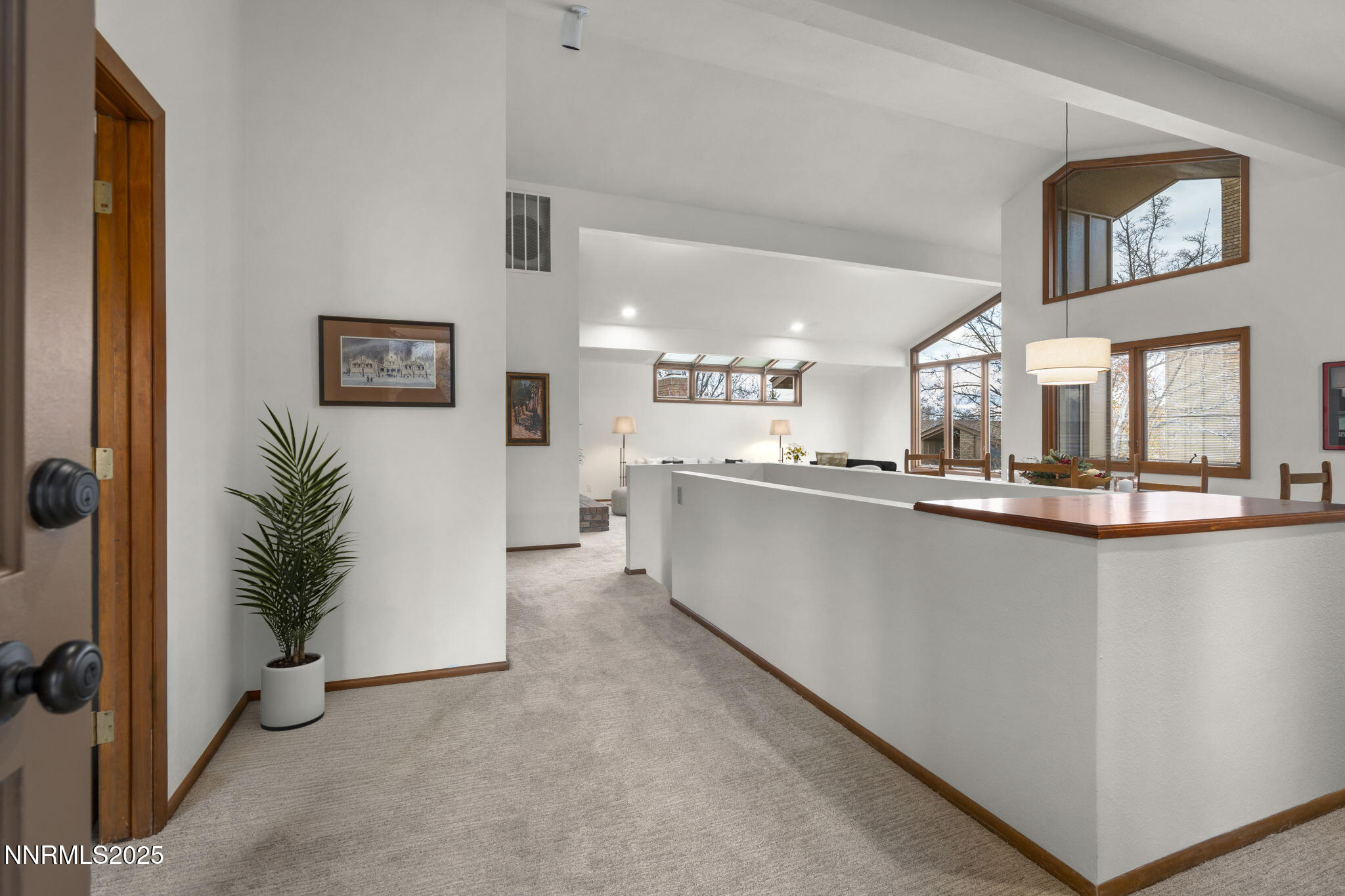 1443 Copper Point Circle Reno, NV 89519 - Photo 2 of 33 a living room with stainless steel appliances kitchen island a large window a sink and a refrigerator