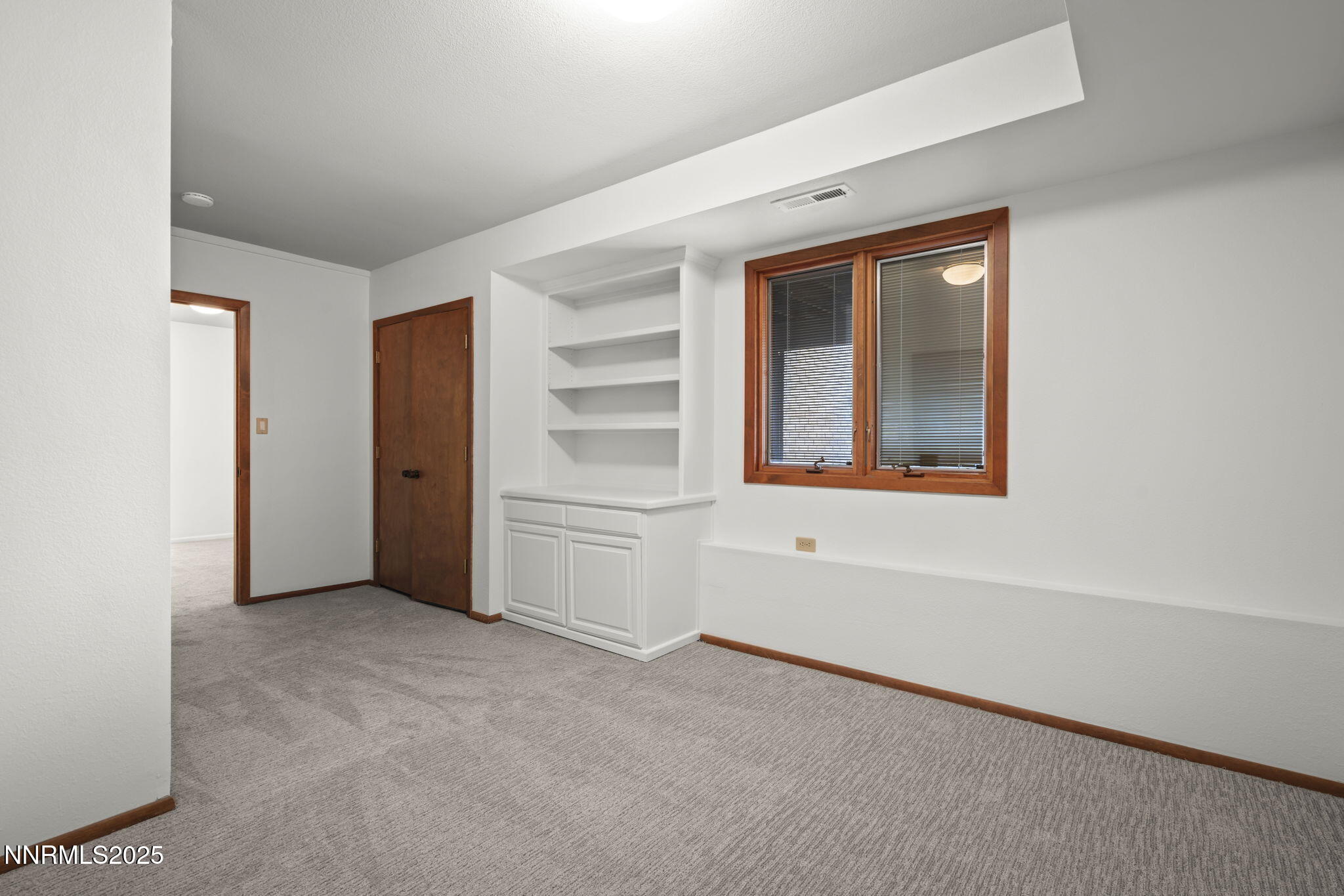 1443 Copper Point Circle Reno, NV 89519 - Photo 21 of 33 a view of an empty room with a window