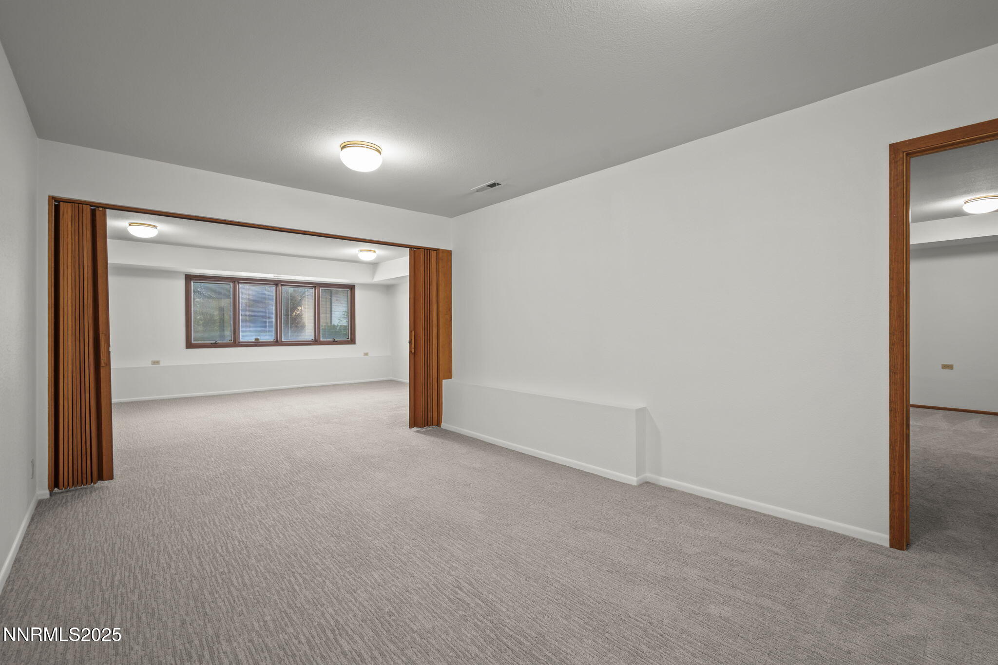 1443 Copper Point Circle Reno, NV 89519 - Photo 22 of 33 a view of an empty room with a window
