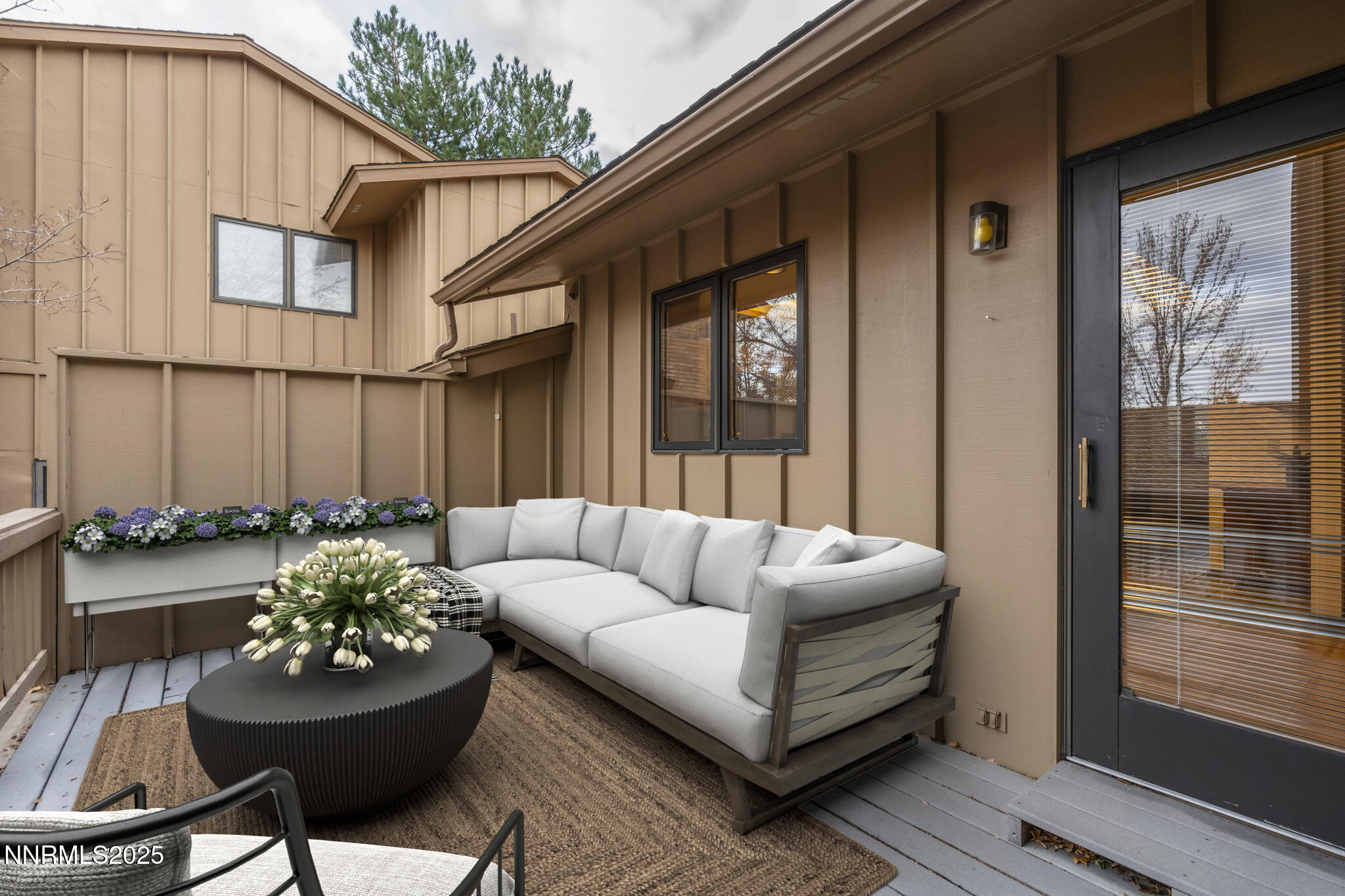1443 Copper Point Circle Reno, NV 89519 - Photo 30 of 33 a living room with furniture and a potted plant