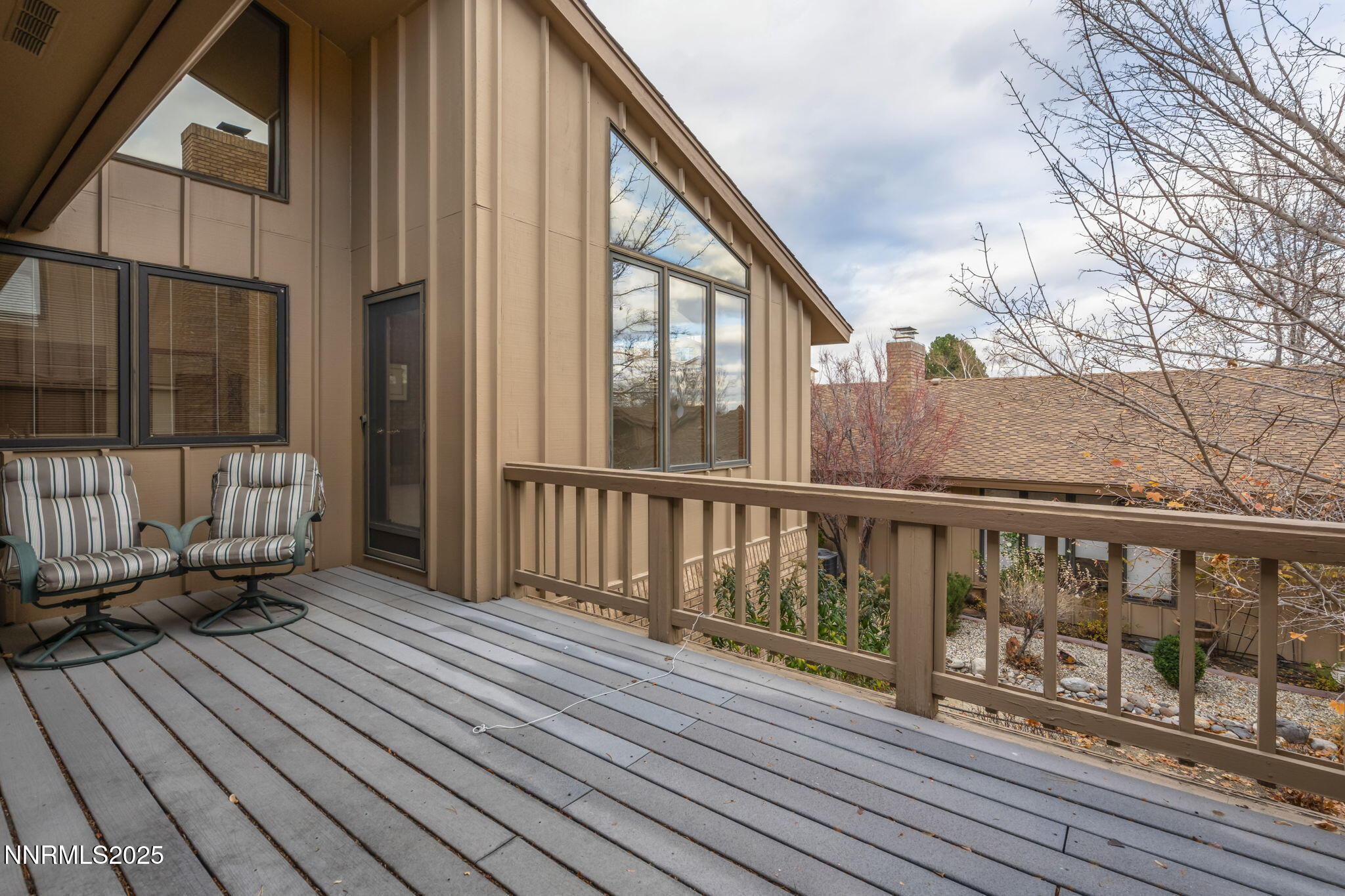 1443 Copper Point Circle Reno, NV 89519 - Photo 31 of 33 a view of wooden balcony with a bench