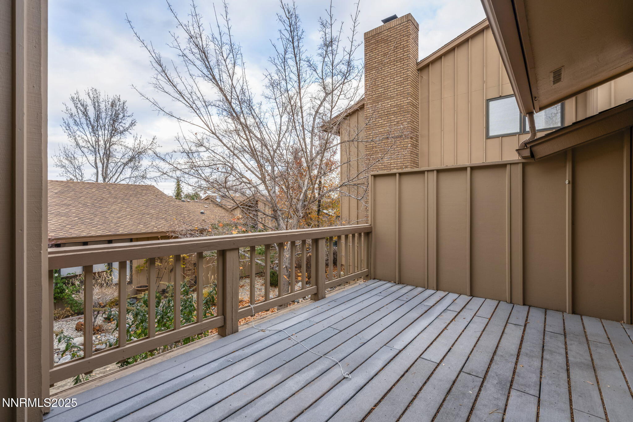 1443 Copper Point Circle Reno, NV 89519 - Photo 33 of 33 a view of wooden balcony with two chairs