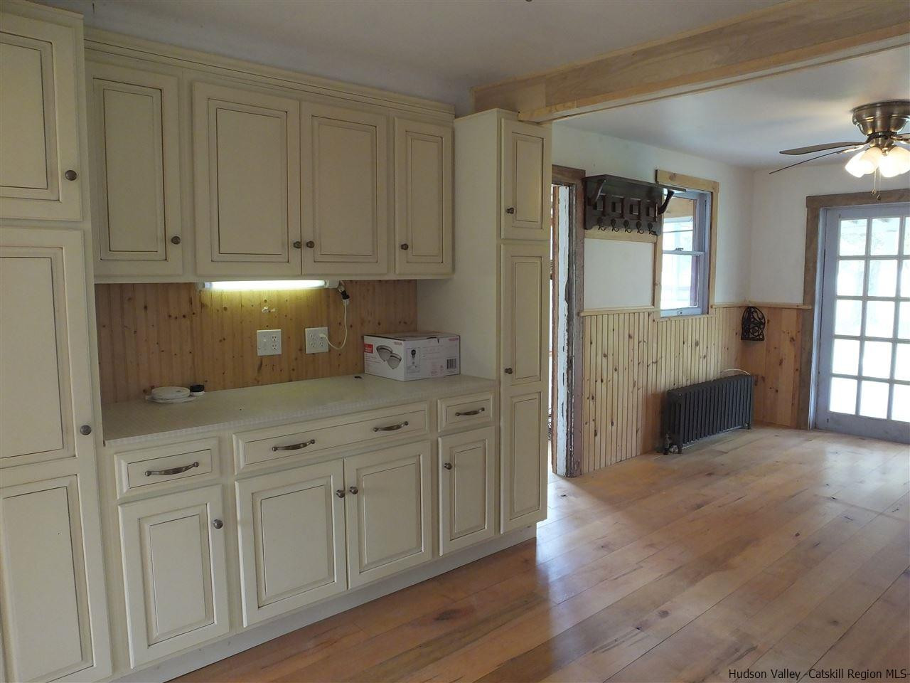 300 Vly Atwood Road Stone Ridge, NY 12484 - Photo 17 of 31 a kitchen with white cabinets and sink