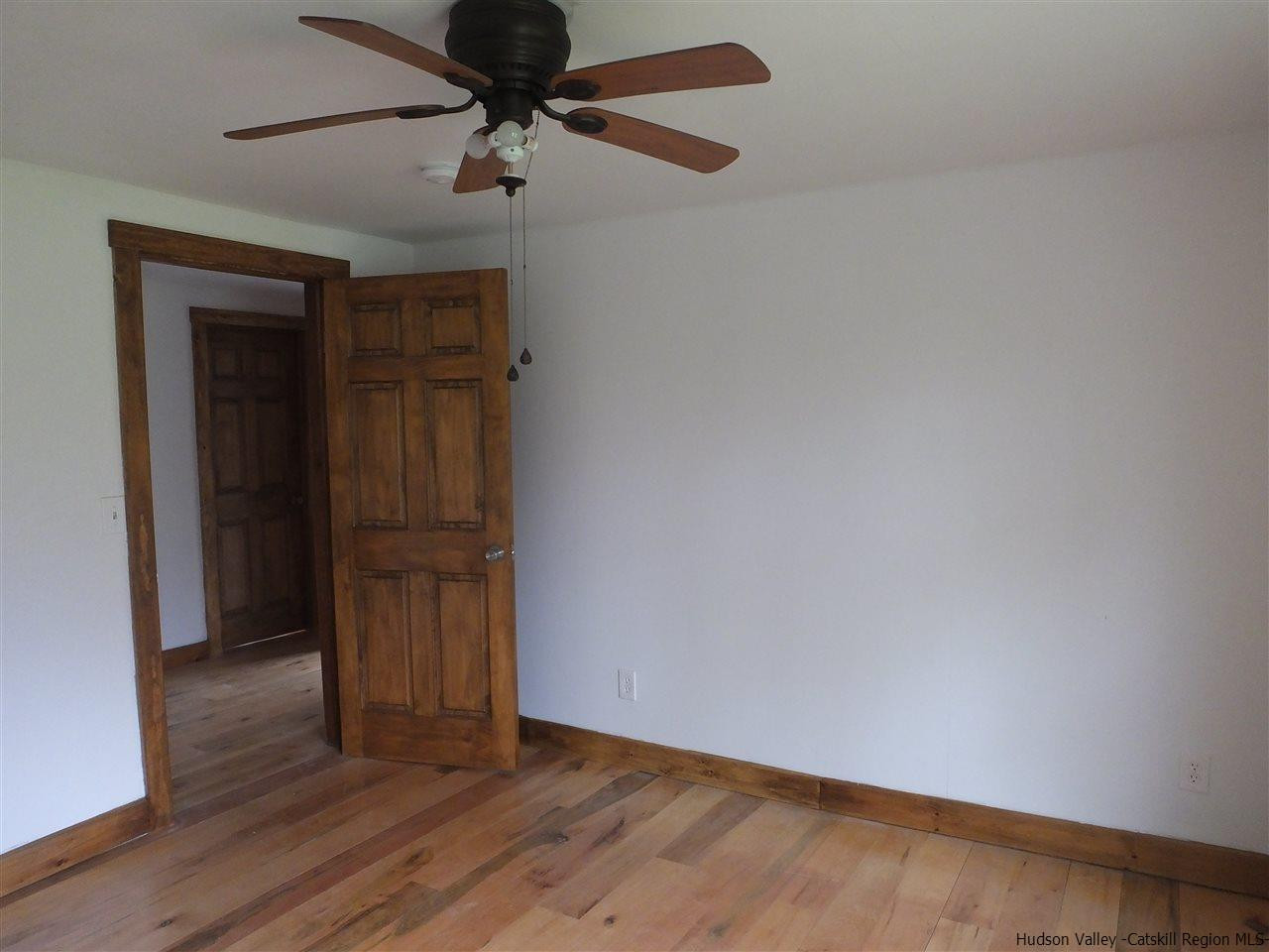 300 Vly Atwood Road Stone Ridge, NY 12484 - Photo 26 of 31 a view of an empty room with wooden floor
