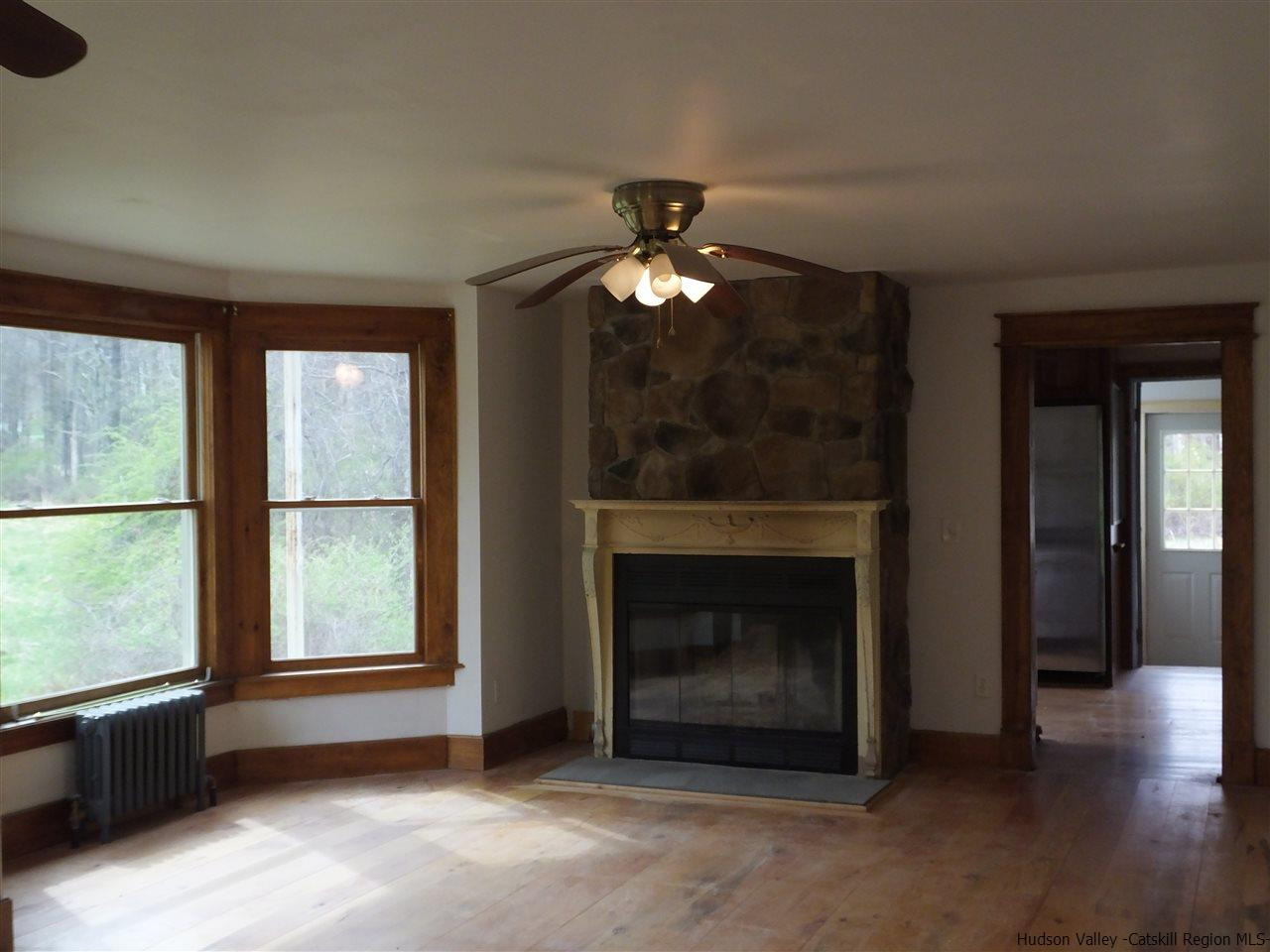 300 Vly Atwood Road Stone Ridge, NY 12484 - Photo 10 of 31 a living room with furniture and a fireplace