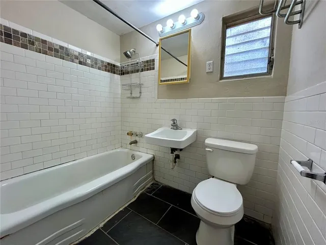 a bathroom with a sink and a toilet