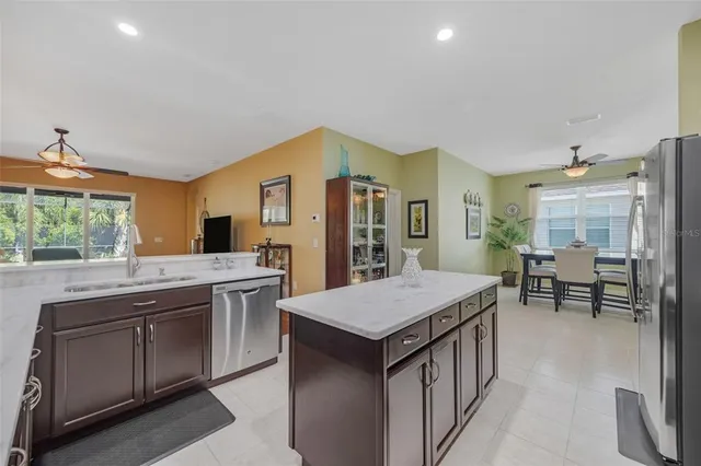 a living room with furniture a window and a chandelier
