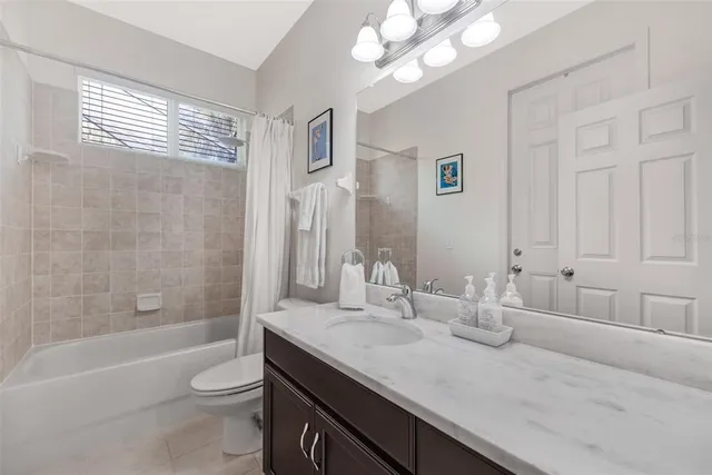 a view of a chair and table in backyard of a house